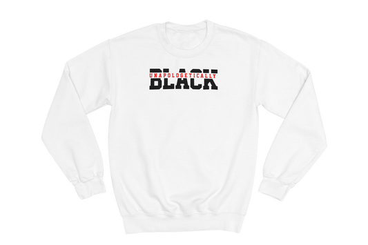 White crewneck sweatshirt with the text 'UNAPOLOGETICALLY BLACK' printed across the chest. 'UNAPOLOGETICALLY' is in small red letters, and 'BLACK' is in large, bold black letters