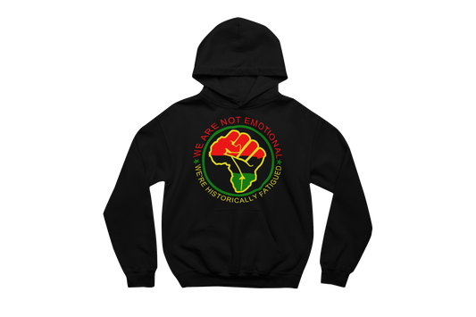 Black hooded sweatshirt with a front pocket, featuring a circular design with a raised fist symbol in Pan-African colors (red, black, green). The fist is surrounded by a green circle, and the text 'WE ARE NOT EMOTIONAL WE'RE HISTORICALLY FATIGUED' is written around it in red, yellow, and green.