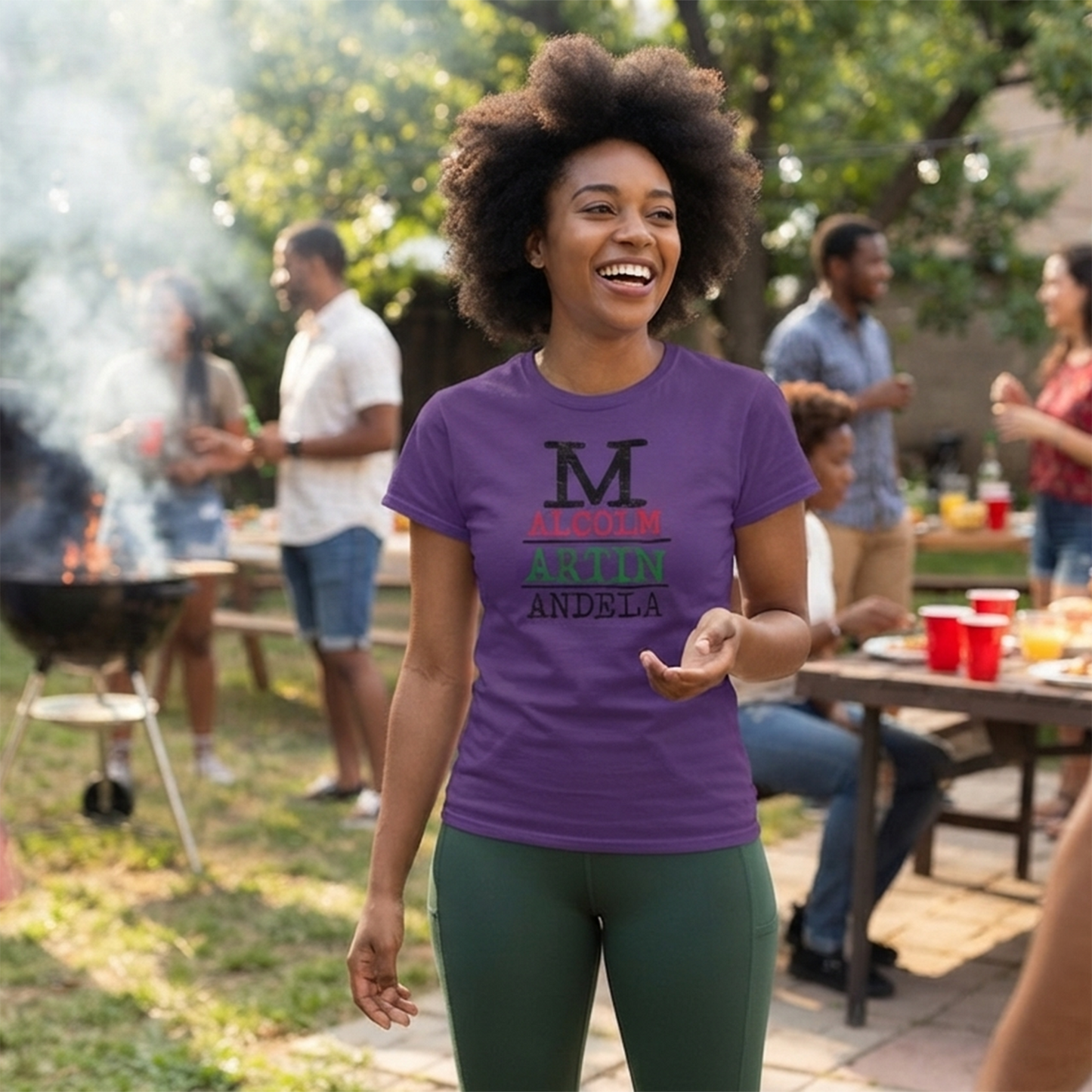 Lifestyle image of a person wearing the Malcolm Martin Mandela purple T-shirt