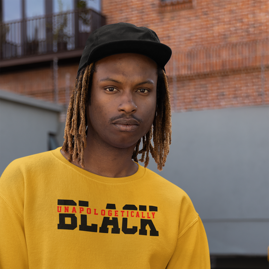 Man wearing a gold Unapologetically Black premium crewneck sweatshirt